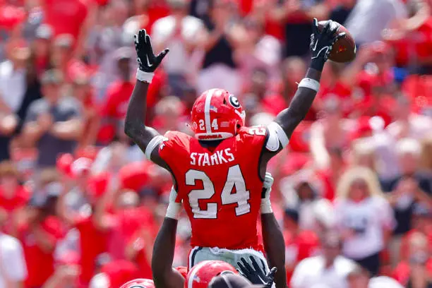 ATHENS, GEORGIA - SEPTEMBER 9: Malaki Starks #24 of the Georgia Bulldogs reacts after an interception during the second quarter against the Ball State Cardinals at Sanford Stadium on September 9, 2023 in Athens, Georgia. (Photo by Todd Kirkland/Getty Images)