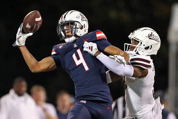 STARKVILLE, MISSISSIPPI - SEPTEMBER 09: Tetairoa McMillan #4 of the Arizona Wildcats catches a pass against Decamerion Richardson #3 of the Mississippi State Bulldogs during the second half at Davis Wade Stadium on September 09, 2023 in Starkville, Mississippi. (Photo by Justin Ford/Getty Images)