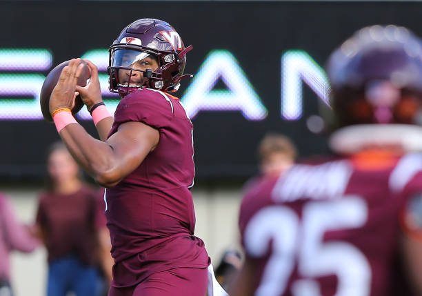 BLACKSBURG, VA - OCTOBER 14: Virginia Tech Hokies Quarterback Kyron Drones (1) throws a pass from the pocket during a college football game between the Wake Forest Demon Deacons and the Virginia Tech Hokies on October 14, 2023, at Lane Stadium in Blacksburg, VA. (Photo by Lee Coleman/Icon Sportswire via Getty Images)