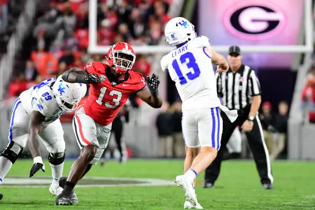 ATHENS, GA - OCTOBER 7: Bulldog defender Mykel Williams #13 rushes Wildcat quarterback Devin Leary #13 during a game between University of Kentucky and University of Georgia at Sanford Stadium on October 7, 2023 in Athens, Georgia. (Photo by Perry McIntyre/ISI Photos/Getty Images)