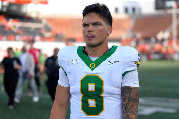 CORVALLIS, OREGON - SEPTEMBER 14: Dillon Gabriel #8 of the Oregon Ducks leaves the field after the game against the Oregon State Beavers at Reser Stadium on September 14, 2024 in Corvallis, Oregon.  (Photo by Soobum Im/Getty Images)