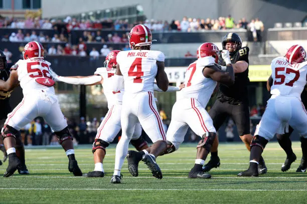 NASHVILLE, TN - OCTOBER 05: Alabama Crimson Tide quarterback Jalen Milroe (4) sits in the pocket as offensive lineman Tyler Booker (52), offensive lineman Parker Brailsford (72), offensive lineman Jaeden Roberts (77), and offensive lineman Elijah Pritchett (57) block during a game between the Vanderbilt Commodores and Alabama Crimson Tide, October 5, 2024 at FirstBank Stadium in Nashville, Tennessee. (Photo by Matthew Maxey/Icon Sportswire via Getty Images)