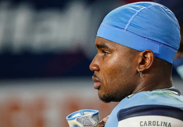 MIAMI GARDENS, FLORIDA - JANUARY 02: Kaimon Rucker #25 of the North Carolina Tar Heels watches the Texas A&amp;M Aggies celebrate after winning the Capital One Orange Bowl 41-27 at Hard Rock Stadium on January 02, 2021 in Miami Gardens, Florida. (Photo by Mark Brown/Getty Images)