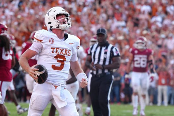 DALLAS, TEXAS - OCTOBER 12: Quinn Ewers #3 of the Texas Longhorns celebrates after scoring a touchdown during the fourth quarter against the Oklahoma Sooners at Cotton Bowl Stadium on October 12, 2024 in Dallas, Texas. (Photo by Sam Hodde/Getty Images)