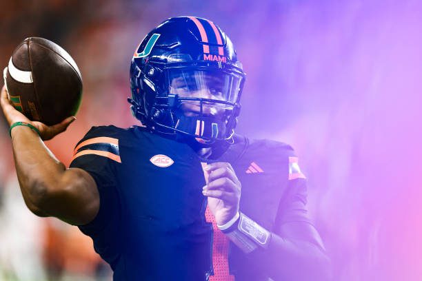 MIAMI GARDENS, FLORIDA - OCTOBER 26: Cam Ward #1 of the Miami Hurricanes warms up on the sideline against the Florida State Seminoles during the first half at Hard Rock Stadium on October 26, 2024 in Miami Gardens, Florida.  (Photo by Carmen Mandato/Getty Images)