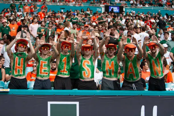 MIAMI GARDENS, FLORIDA - NOVEMBER 02: Miami Hurricanes fans are pictured with HEISMAN in the stands during the game between Miami Hurricanes and Duke at Hard Rock Stadium on November 2, 2024 in Miami Gardens, Florida. (Photo by Michael Pimentel/ISI Photos/Getty Images)