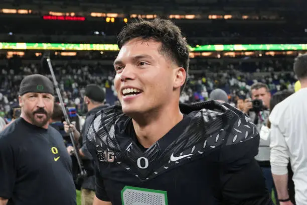 INDIANAPOLIS, INDIANA - DECEMBER 07: Dillon Gabriel #8 of the Oregon Ducks celebrates after beating the Penn State Nittany Lions 45-37 to win the 2024 Big Ten Football Championship at Lucas Oil Stadium on December 07, 2024 in Indianapolis, Indiana. (Photo by Dylan Buell/Getty Images)