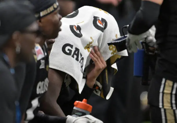 SAN ANTONIO, TEXAS - DECEMBER 28: Colorado Buffaloes quarterback Shedeur Sanders (2) covers his head with a towel near the end of the game at the Alamodome in San Antonio, Texas on December 28, 2024. The Colorado Buffaloes lost 36 to 14 to the Brigham Young Cougars in the Valero Alamo Bowl. (Photo by RJ Sangosti/MediaNews Group/The Denver Post via Getty Images)