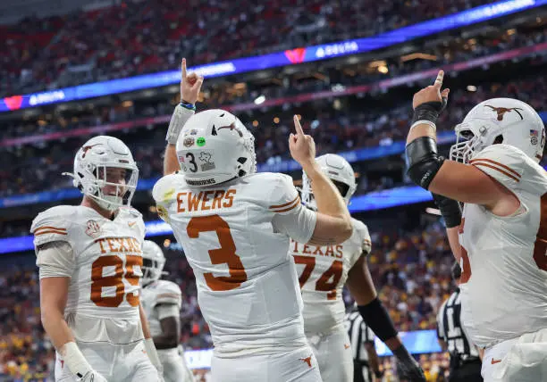 ATLANTA, GEORGIA - JANUARY 1: Quinn Ewers #3 of the Texas Longhorns celebrates after scoring a touchdown against the Arizona State Sun Devils during second half against at Mercedes-Benz Stadium on January 1, 2025 in Atlanta, Georgia. (Photo by CFP/Getty Images)