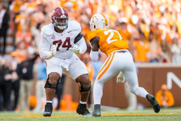 KNOXVILLE, TN - OCTOBER 19: Alabama Crimson Tide offensive lineman Kadyn Proctor (74) blocks Tennessee Volunteers defensive lineman James Pearce Jr. (27) during the college football game between the Tennessee Volunteers and the Alabama Crimson Tide on October 19, 2024, at Neyland Stadium in Knoxville, TN. (Photo by Bryan Lynn/Icon Sportswire via Getty Images)