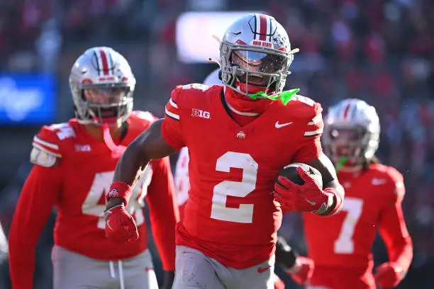 gettyimages-2187065010-612x612 COLUMBUS, OHIO - NOVEMBER 30: Caleb Downs #2 of the Ohio State Buckeyes reacts after intercepting the ball during the third quarter of a game against the Michigan Wolverines at Ohio Stadium on November 30, 2024 in Columbus, Ohio. (Photo by Ben Jackson/Getty Images)
