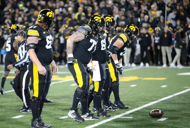 gettyimages-2183042968-612x612 IOWA CITY, IOWA- NOVEMBER 02:  Offensive linemen Gennings Dunker #67, Logan Jones #65, Connor Colby #77, Beau Stevens #70 and Mason Richman #78 of the Iowa Hawkeyes walk to the line during the first half against the Wisconsin Badgers, at Kinnick Stadium. on November 2, 2024 in Iowa City, Iowa.  (Photo by Matthew Holst/Getty Images)