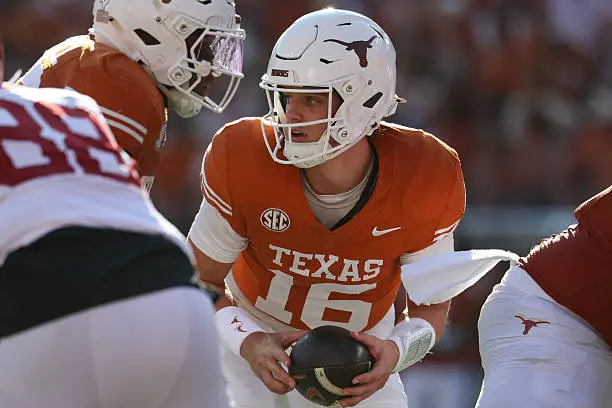 AUSTIN, TX - NOVEMBER 22: Quarterback Arch Manning #16 of the Texas Longhorns turns with the ball after a snap during the SEC football game between Texas Longhorns and Arkansas Razorbacks on November 22, 2025, at Darrell K Royal-Texas Memorial Stadium in Austin, TX. (Photo by David Buono/Icon Sportswire via Getty Images)