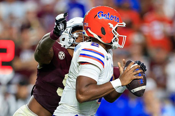 COLLEGE STATION, TX - OCTOBER 11: Texas A&amp;M Aggies defensive end Cashius Howell (9) sacks Florida Gators quarterback DJ Lagway (2) during the second half of the game on October 11, 2025, at Kyle Stadium in College Station, TX. (Photo by Adam Davis/Icon Sportswire via Getty Images)
