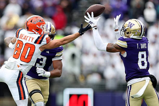 SEATTLE, WASHINGTON - OCTOBER 25: Tacario Davis #8 of the Washington Huskies intercepts a pass intended for Hank Beatty #80 of the Illinois Fighting Illini during the second half at Husky Stadium on October 25, 2025 in Seattle, Washington. (Photo by Steph Chambers/Getty Images)