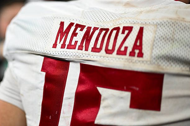 INDIANAPOLIS, IN - DECEMBER 06: The name plate of Indiana Hoosiers QB Fernando Mendoza (15) stitched to the back of his jersey while he celebrates winning the Big Ten Championship football game between the Indiana Hoosiers and the Ohio State Buckeyes on December 6, 2025 at Lucas Oil Stadium in Indianapolis, IN. (Photo by James Black/Icon Sportswire via Getty Images)