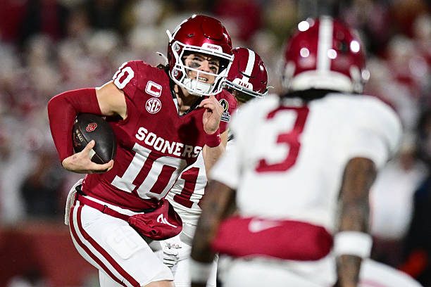 NORMAN, OKLAHOMA - DECEMBER 19: John Mateer #10 of the Oklahoma Sooners runs with the ball in the first half against the Alabama Crimson Tide during 2025 College Football Playoff First Round Game at Gaylord Family Oklahoma Memorial Stadium on December 19, 2025 in Norman, Oklahoma. (Photo by CFP/Getty Images)