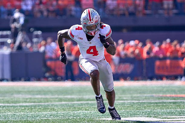 CHAMPAIGN, ILLINOIS - OCTOBER 11: Wide Receiver Jeremiah Smith #4 of the Ohio State Buckeyes runs in action during a game between the Illinois Fighting Illini and the Ohio State Buckeyes at Memorial Stadium on October 11, 2025 in Champaign, Illinois. (Photo by Robin Alam/ISI Photos/ISI Photos via Getty Images)