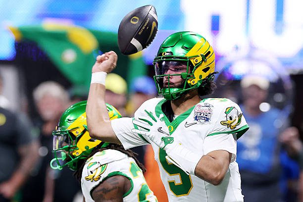 ATLANTA, GEORGIA - JANUARY 09: Dante Moore #5 of the Oregon Ducks loses the ball against the Indiana Hoosiers during the second quarter in the 2025 College Football Playoff Semifinal at the Chick-fil-A Peach Bowl at Mercedes-Benz Stadium on January 09, 2026 in Atlanta, Georgia. (Photo by Kevin C. Cox/Getty Images)