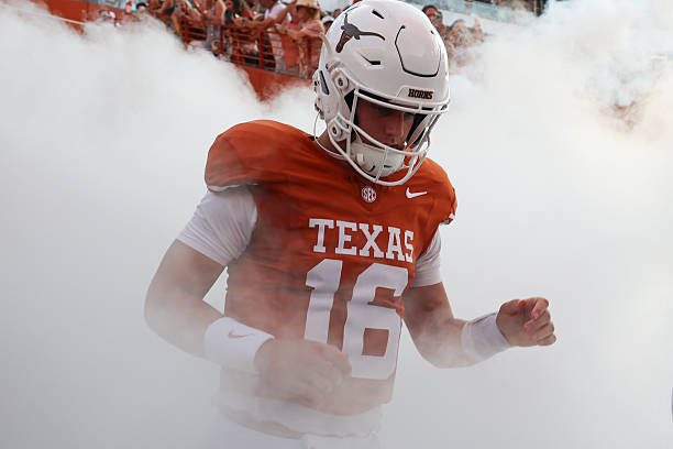 AUSTIN, TX - SEPTEMBER 12: Quarterback Arch Manning #16 of the Texas Longhorns runs onto the field surrounded by smoke before the start of the college football game the Texas Longhorns and the Ohio State Buckeyes on September 12, 2026, at Darrell K Royal-Texas Memorial Stadium in Austin, TX. (Photo by David Buono/Icon Sportswire via Getty Images)