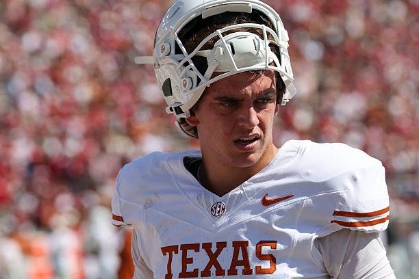 DALLAS, TX - OCTOBER 10: Texas Longhorns quarterback Arch Manning #16 balances his helmet on his head before the Allstate Red River Rivalry between the Texas Longhorns and Oklahoma Sooners on October 10, 2026, at Cotton Bowl Stadium in Dallas, TX. (Photo by David Buono/Icon Sportswire via Getty Images)