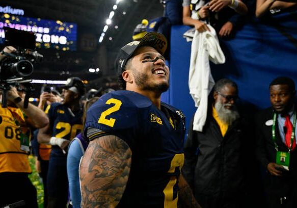 HOUSTON, TEXAS - JANUARY 08: Blake Corum #2 of the Michigan Wolverines smiles after the 2024 CFP National Championship game against the Washington Huskies at NRG Stadium on January 08, 2024 in Houston, Texas. The Michigan Wolverines won 34-13. (Photo by Alika Jenner/Getty Images)