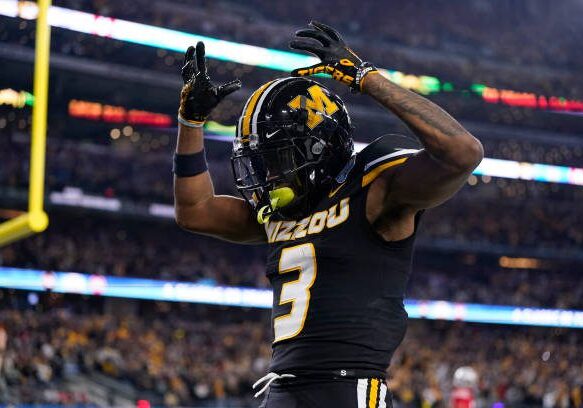 ARLINGTON, TEXAS - DECEMBER 29: Luther Burden III #3 of the Missouri Tigers celebrates after catching a pass for a touchdown during the fourth quarter against the Ohio State Buckeyes in the Goodyear Cotton Bowl at AT&amp;T Stadium on December 29, 2023 in Arlington, Texas. (Photo by Sam Hodde/Getty Images)