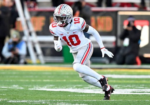 COLLEGE PARK, MARYLAND - NOVEMBER 19: Denzel Burke #10 of the Ohio State Buckeyes defends against the Maryland Terrapins at SECU Stadium on November 19, 2022 in College Park, Maryland. (Photo by G Fiume/Getty Images)