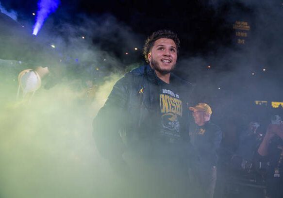 ANN ARBOR, MICHIGAN - JANUARY 13: Blake Corum #2 of the Michigan Wolverines walks out the tunnel before the National Championship Celebration at Crisler Center on January 13, 2024 in Ann Arbor, Michigan. (Photo by Aaron J. Thornton/Getty Images)