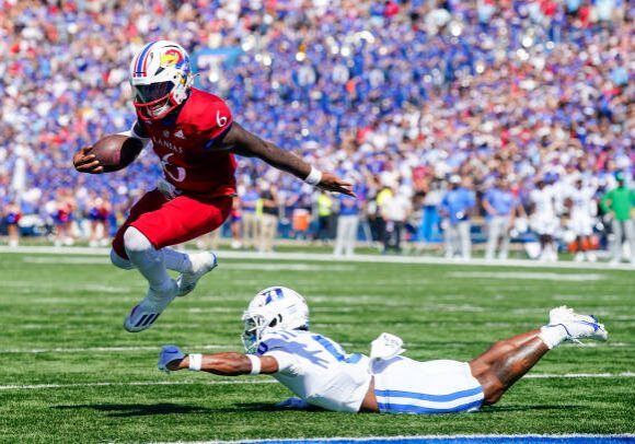 LAWRENCE, KS - SEPTEMBER 24: Jalon Daniels #6 of the Kansas Jayhawks runs for a touchdown past Chandler Rivers #0 of the Duke Blue Devils during the second half at David Booth Kansas Memorial Stadium on September 24, 2022 in Lawrence, Kansas. Kansas defeated Duke 35-27. (Photo by Jay Biggerstaff/Getty Images)