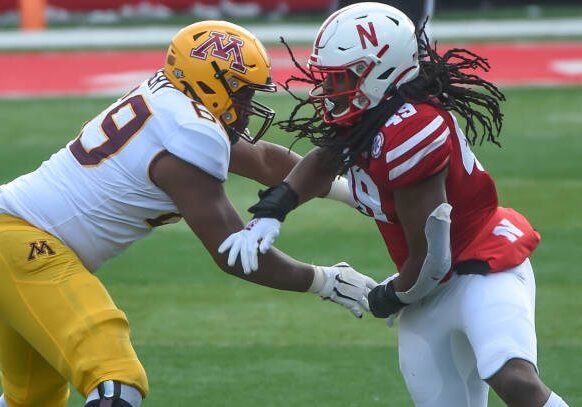 LINCOLN, NE - DECEMBER 12: Offensive lineman Aireontae Ersery #69 of the Minnesota Golden Gophers blocks linebacker Pheldarius Payne #49 of the Nebraska Cornhuskers in the second half at Memorial Stadium on December 12, 2020 in Lincoln, Nebraska. (Photo by Steven Branscombe/Getty Images)