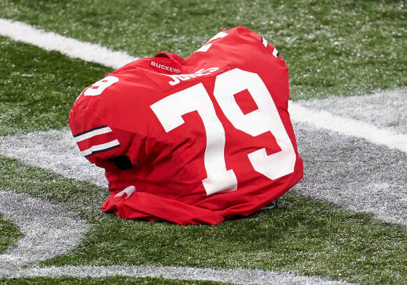 INDIANAPOLIS, IN - DECEMBER 19: A detail view of the shoulder pad belonging to Ohio State Buckeyes offensive lineman Dawand Jones (79) rests on the field in action during the Big Ten Championship game between the Ohio State Buckeyes and the Northwestern Wildcats on December 19, 2020 at Lucas Oil stadium, in Indianapolis, IN. (Photo by Robin Alam/Icon Sportswire via Getty Images)