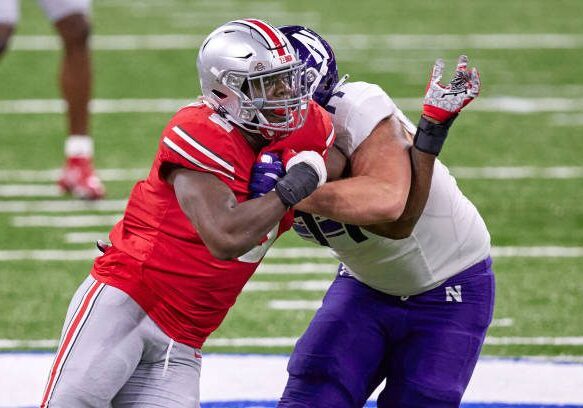 INDIANAPOLIS, IN - DECEMBER 19: Ohio State Buckeyes defensive end Zach Harrison (9) battles with Northwestern Wildcats offensive lineman Peter Skoronski (77) in action during the Big Ten Championship game between the Ohio State Buckeyes and the Northwestern Wildcats on December 19, 2020 at Lucas Oil stadium, in Indianapolis, IN. (Photo by Robin Alam/Icon Sportswire via Getty Images)