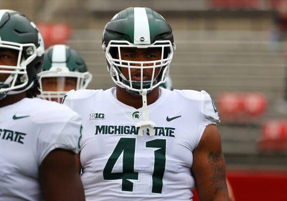 PISCATAWAY, NJ - OCTOBER 09:  Michigan State Spartans defensive tackle Derrick Harmon (41)  warms up prior to the college football game between the Rutgers Scarlet Knights and the Michigan State Spartans on October 9, 2021 at SHI Stadium in Piscataway,NJ.   (Photo by Rich Graessle/Icon Sportswire via Getty Images)