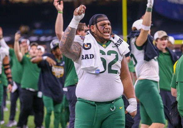NEW ORLEANS, LA - JANUARY 01: Baylor Bears defensive tackle Siaki Ika (62) cheers with the crowd after the Sugar Bowl between the Ole Miss Rebels and the Baylor Bears on January 1, 2022, at the Caesars Superdome in New Orleans, LA. (Photo by Chris McDill/Icon Sportswire via Getty Images)