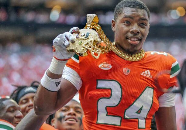 Miami Hurricanes safety Kamren Kinchens (24) got to be the first Miami player to wear the new chain in 2021, only it technically never happened. The safety forced a fumble in the second quarter at Mercedes-Benz Stadium and had the chain placed around his neck to celebrate a turnover that never actually happened during game against the Alabama Crimson Tide in Atlanta on Saturday, Sept. 4, 2021. (Al Diaz/Miami Herald/Tribune News Service via Getty Images)