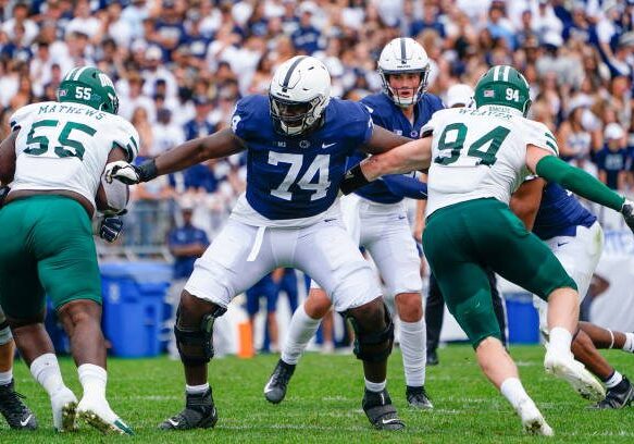 UNIVERSITY PARK, PA - SEPTEMBER 10: Penn State Nittany Lions Offensive Lineman Olumuyiwa Fashanu (74) blocks during the second half of the College Football game between the Ohio Bobcats and Penn State Nittany Lions on September 10, 2022, at Beaver Stadium in University Park, PA. (Photo by Gregory Fisher/Icon Sportswire via Getty Images)