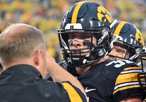 IOWA CITY, IA - SEPTEMBER 17: Iowa middle linebacker Jack Campbell (31) talks with Iowa linebacker coach Seth Wallace during a college football game between the Nevada Wolfpack and the Iowa Hawkeyes,  September 17, 2022, at Kinnick Stadium, Iowa City, IA. Photo by Keith Gillett/Icon Sportswire via Getty Images),
