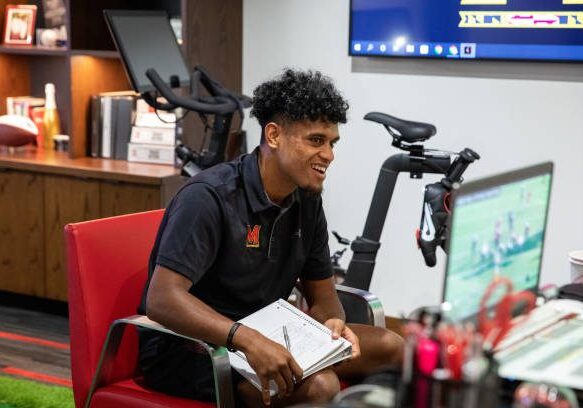 COLLEGE PARK, MARYLAND - Quarterback Taulia Tagovailoa takes notes while going over tape of previous plays at the University of Maryland in College Park, Maryland, on September 13, 2022. (Amanda Andrade-Rhoades/For The Washington Post via Getty Images)