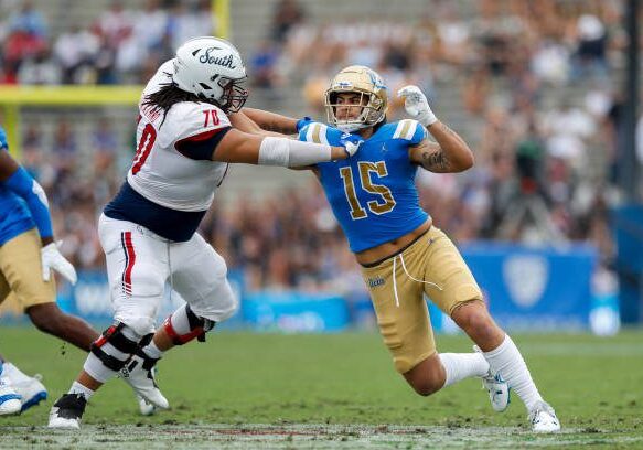 PASADENA, CA - SEPTEMBER 17: UCLA Bruins linebacker Laiatu Latu (15) rushes the passer and gets blocked by South Alabama Jaguars offensive lineman Adrein Strickland (70) during a college football game between the South Alabama Jaguars and the UCLA Bruins on September 17, 2022, at the Rose Bowl Stadium in Pasadena, CA. (Photo by Jordon Kelly/Icon Sportswire via Getty Images)