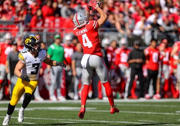 COLUMBUS, OH - OCTOBER 22: Ohio State Buckeyes wide receiver Julian Fleming (4) makes a catch as Iowa Hawkeyes defensive back Cooper DeJean (3) defends during the first quarter of the college football game between the Iowa Hawkeyes and Ohio State Buckeyes on October 22, 2022, at Ohio Stadium in Columbus, OH. (Photo by Frank Jansky/Icon Sportswire via Getty Images)