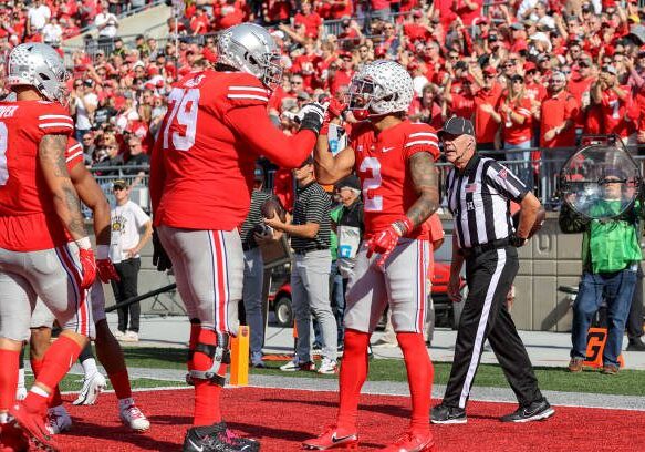 COLUMBUS, OH - OCTOBER 22: Ohio State Buckeyes wide receiver Emeka Egbuka (2) is congratulated by Ohio State Buckeyes offensive lineman Dawand Jones (79) after making 13-yard touchdown catch during the third quarter of the college football game between the Iowa Hawkeyes and Ohio State Buckeyes on October 22, 2022, at Ohio Stadium in Columbus, OH. (Photo by Frank Jansky/Icon Sportswire via Getty Images)
