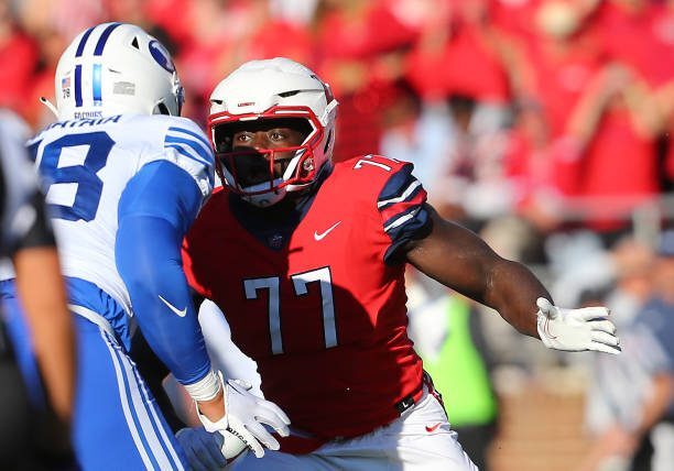 LYNCHBURG, VA - OCTOBER 22: BYU Cougars offensive lineman Kingsley Suamataia (78) attempts to block Liberty Flames defensive lineman Khristian Zachary (77) during a college football game between the BYU Cougars and the Liberty Flames on October 22, 2022, at Williams Stadium in Lynchburg, VA. (Photo by Lee Coleman/Icon Sportswire via Getty Images)