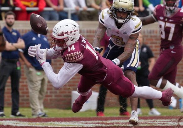 TALLAHASSEE, FL - OCTOBER 29: Florida State Seminoles wide receiver Johnny Wilson (14) cant hang not to the pass during the game between the Georgia Tech Yellow Jackets and the Florida State Seminoles on Saturday, October 29, 2022 at Oak Campbell Stadium in Tallahassee, FL (Photo by Peter Joneleit/Icon Sportswire via Getty Images)