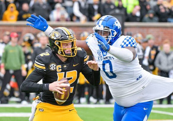 COLUMBIA, MO - NOVEMBER 05: Kentucky Wildcats defensive tackle Deone Walker (0) gets ready to sack Missouri Tigers quarterback Brady Cook (12) during a SEC conference game between the Kentucky Widlcats and the Missouri Tigers held on Saturday NOV 05, 2022 at Faurot Field at Memorial Stadium in Columbia MO. (Photo by Rick Ulreich/Icon Sportswire via Getty Images