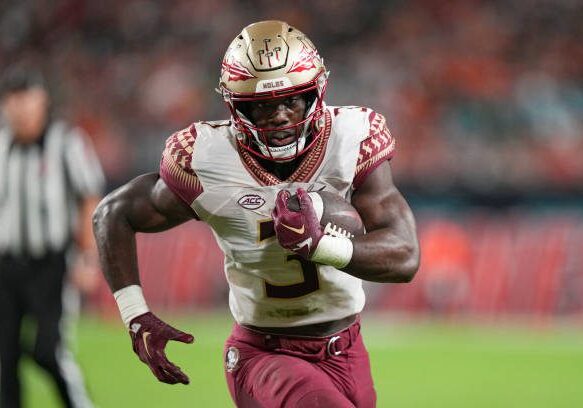 MIAMI GARDENS, FL - NOVEMBER 05: Trey Benson #3 of the Florida State Seminoles rushes for a touchdown during the second quarter against the Miami Hurricanes at Hard Rock Stadium on November 5, 2022 in Miami Gardens, Florida. (Photo by Eric Espada/Getty Images)