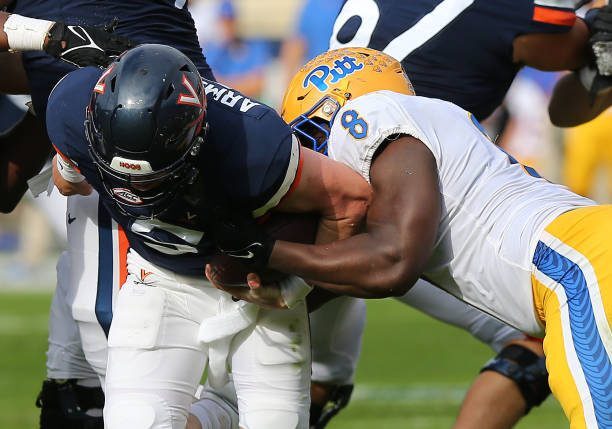 CHARLOTTESVILLE, VA - NOVEMBER 12: Pittsburgh Panthers defensive lineman Calijah Kancey (8) sacks Virginia Cavaliers quarterback Brennan Armstrong (5) during a college football game between the Pittsburgh Panthers and the Virginia Cavaliers on November 12, 2022, at Scott Stadium in Charlottesville, VA. (Photo by Lee Coleman/Icon Sportswire via Getty Images)