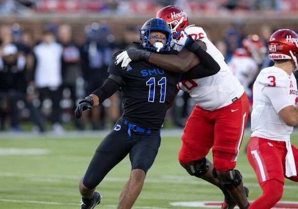 DALLAS, TX - NOVEMBER 05: SMU Mustangs defensive end Je'lin Samuels (#11) tries to get around the block of Houston Cougars offensive tackle Patrick Paul (#76) during the college football game between the SMU Mustangs and the Houston Cougars on November 05, 2022, at Gerald J. Ford Stadium in Dallas, TX.  (Photo by Matthew Visinsky/Icon Sportswire via Getty Images)