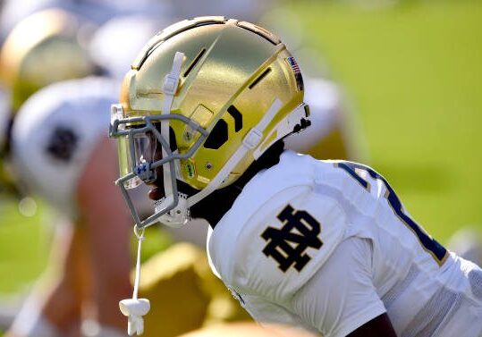 BALTIMORE, MD - NOVEMBER 12: A close up side view of a Notre Dame golden / gold Schutt football helmet shining in the afternoon sunlight on Notre Dame cornerback Benjamin Morrison (20) during the Notre Dame Fighting Irish versus Navy Midshipmen game on November 12, 2022 at M&amp;T Bank Stadium in Baltimore, MD. (Photo by Randy Litzinger/Icon Sportswire via Getty Images)