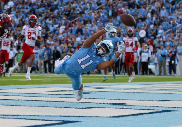 CHAPEL HILL, NC - NOVEMBER 25: Josh Downs (11) of the North Carolina Tar Heels dives in attempt to catch a pass during a football game between the North Carolina Tar Heels and the North Carolina State Wolfpack on Nov 25, 2022 at Kenan Memorial Stadium in Chapel Hill, NC. (Photo by David Jensen/Icon Sportswire via Getty Images)